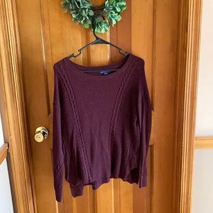 Burgundy sweater with braided design